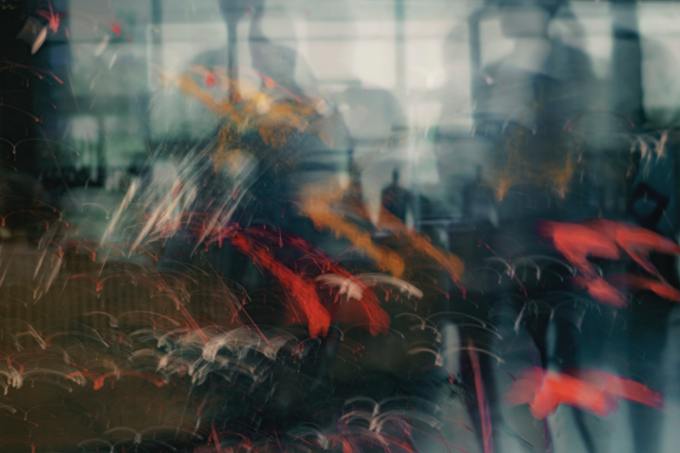 Swirling lines in front of a blurred window