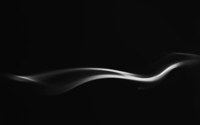 Wisps of gray on a black background
