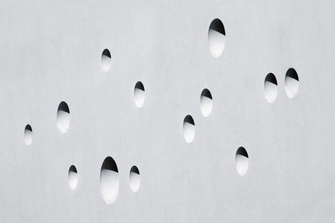 Circles drilled into a concrete wall