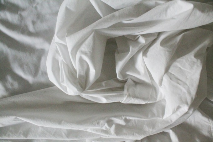 Jumbled white bedsheets